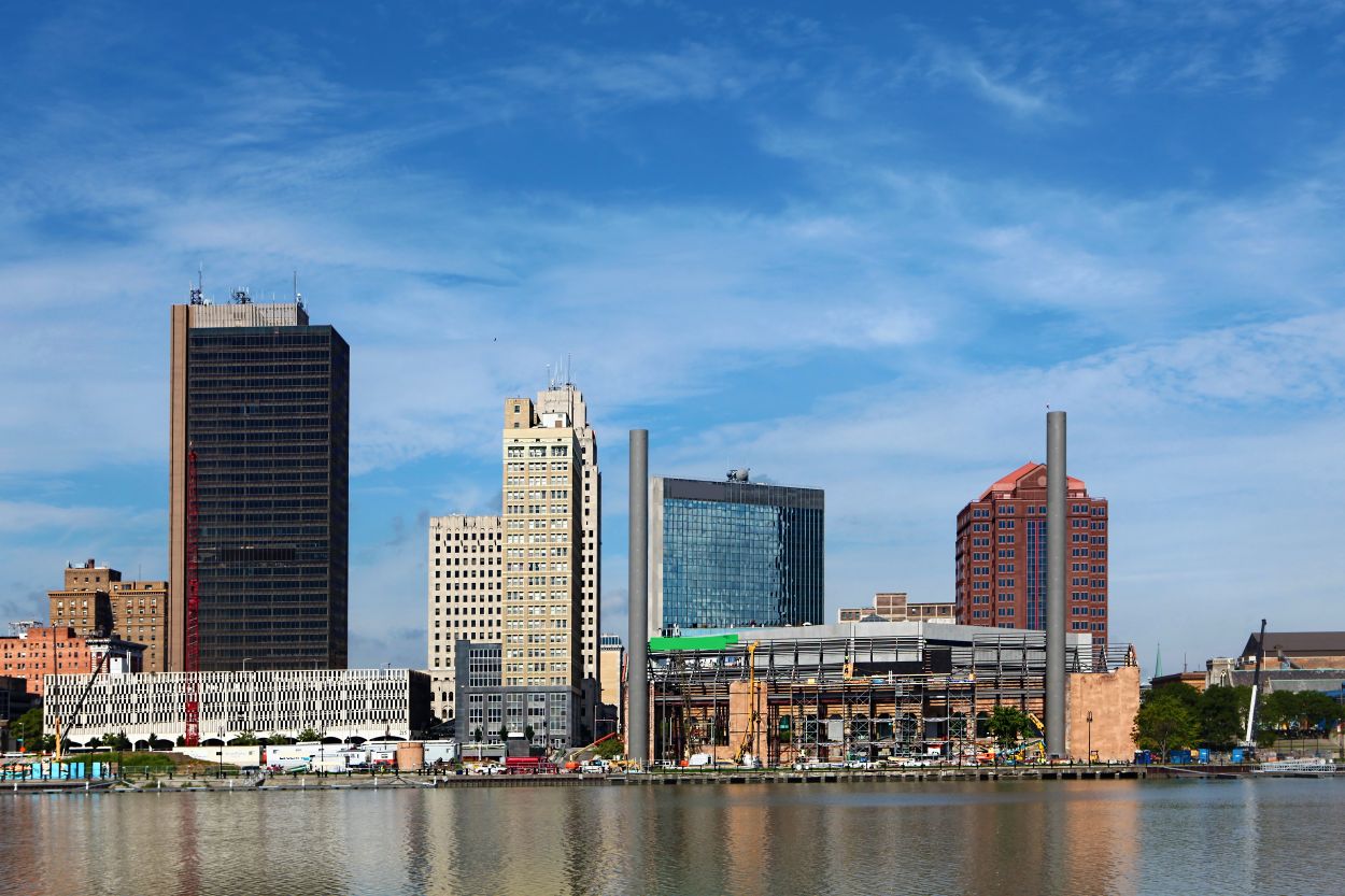 City skyline with modern buildings under a blue sky